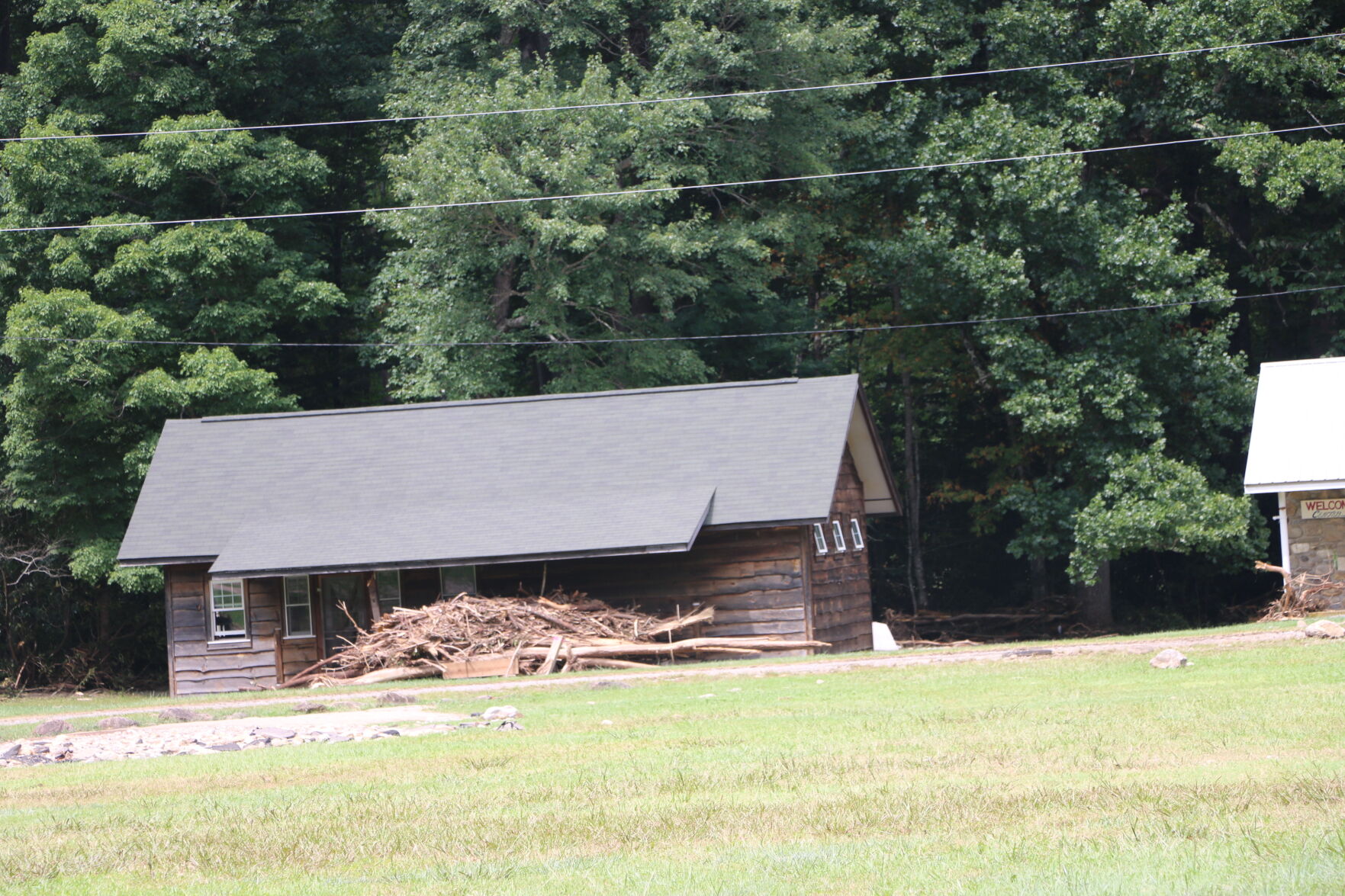 cabin with debris.JPG